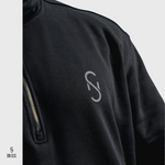 Person wearing a black SN Clo 3/4 zip sweatshirt with SN Clo logo on the front against a white background