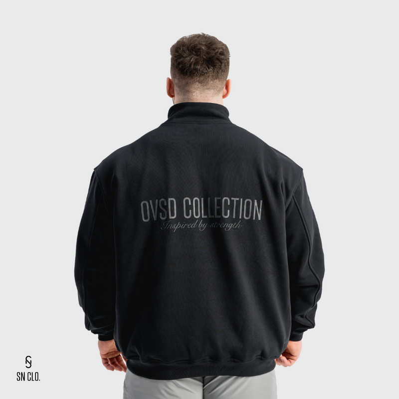 Person wearing a black SN Clo 3/4 zip sweatshirt with 'OVSD Collection' text on the back against a white background