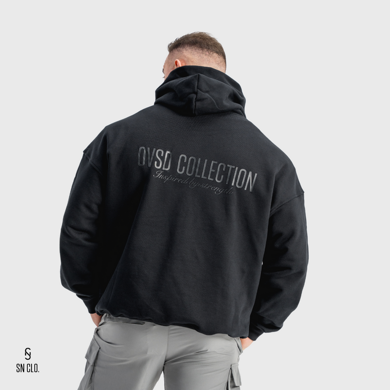 Person wearing a black hoody with 'OVSD Collection' text on the back against a white background