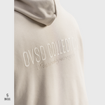Beige SN Clo. hoodie with 'OVSD Collection' text on a light grey background
