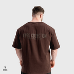 Man wearing a brown Sn Clo t-shirt with 'OVSD Collection' text on the back against a white background