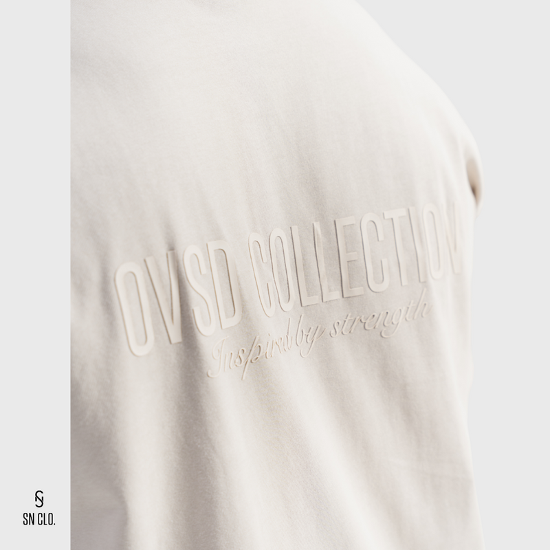 Beige SN Clo. tee with 'OVSD Collection' text on a white background