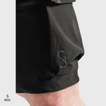 Black SN Clo. cargo shorts with a visible brand label on a light grey background