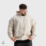 Man wearing a beige hoody with an SN Clo logo on a grey background