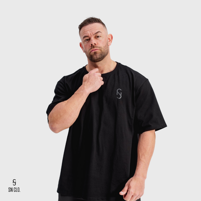 Man wearing a black t-shirt with a SN Clo logo on a white background