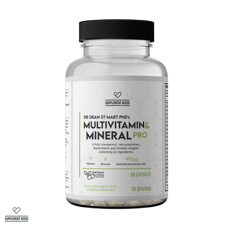 A clear supplement bottle with a black ribbed cap and a white label reading 'Supplement Needs' and 'Dr Dean St Mart Phd's Multivitamin & Mineral Pro' 60 servings. The bottle is shown on a white background with several beige capsules visible through the transparent lower portion.